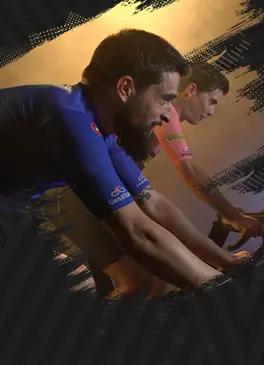 Two cyclists practicing real indoor cycling