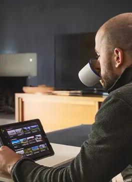 Man looking at his tablet with a virtual indoor cycling app